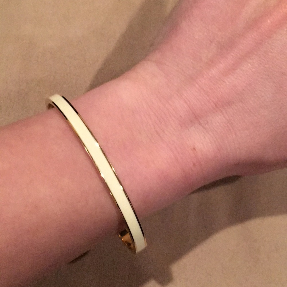Kate Spade cream and gold bangle